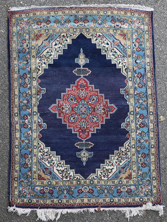 A Persian rug, 4ft 10in by 3ft 5in.